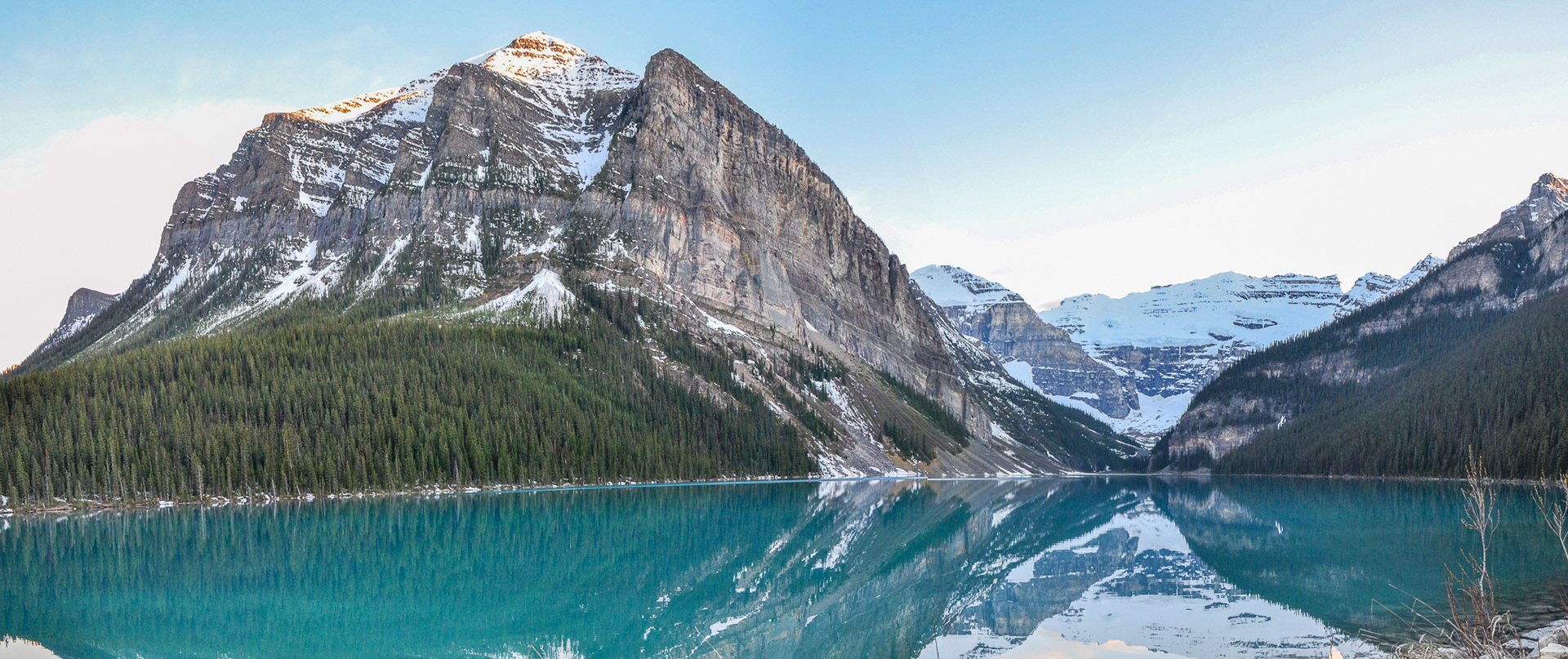 Lake Louise, the breathtaking panorama of the forest, sheer mountain rockfaces and snowcapped glaciers reflected in the still, turquoise lake is truly spectacular.