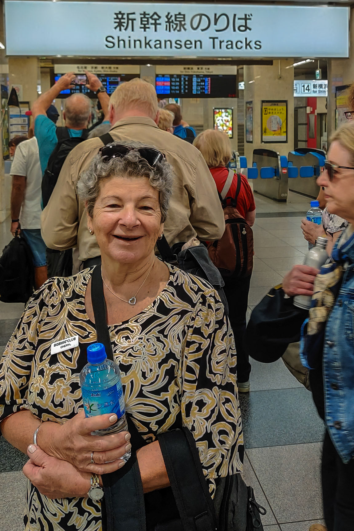 Cheryl joins the queue for our first Shinkensen experience.