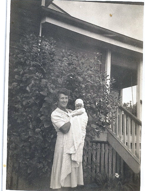 Marie with Lorraine in front of the main homestead.