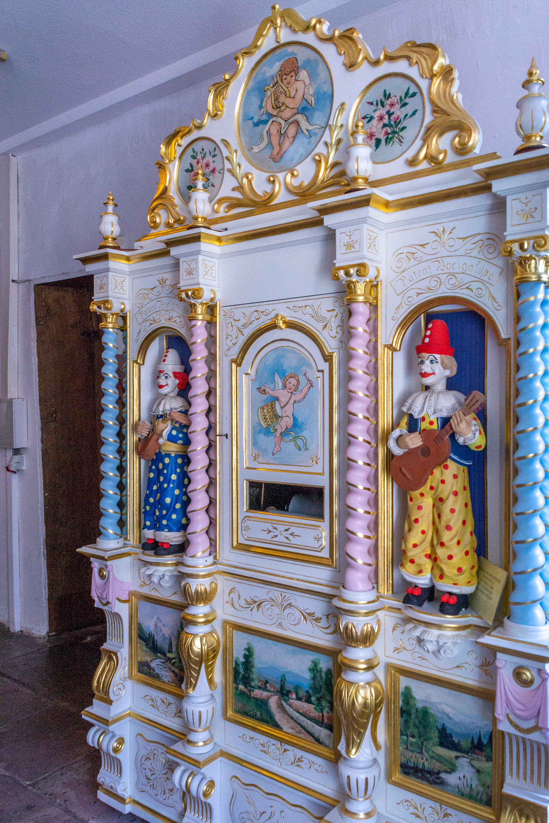 Porcelain clown music machine.