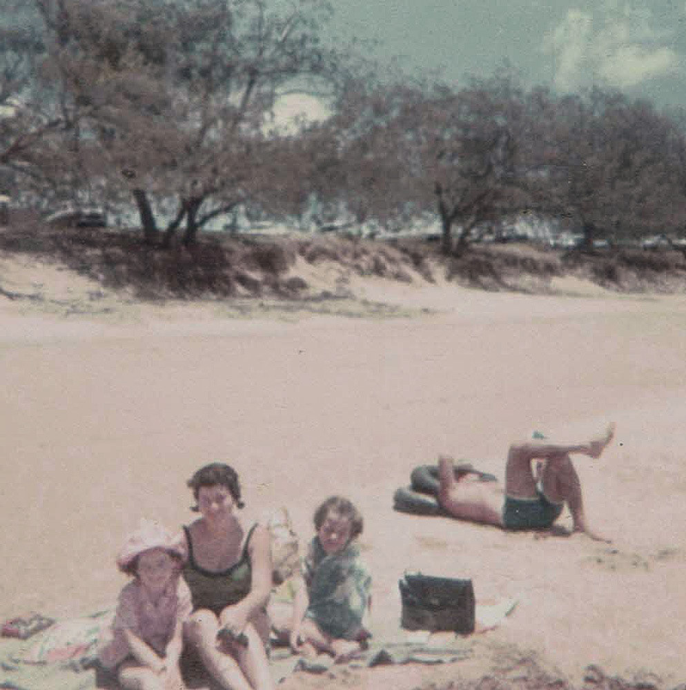 Cheryl with Julie and Leanne at the beach. Bill reclining in the background 19-11-67