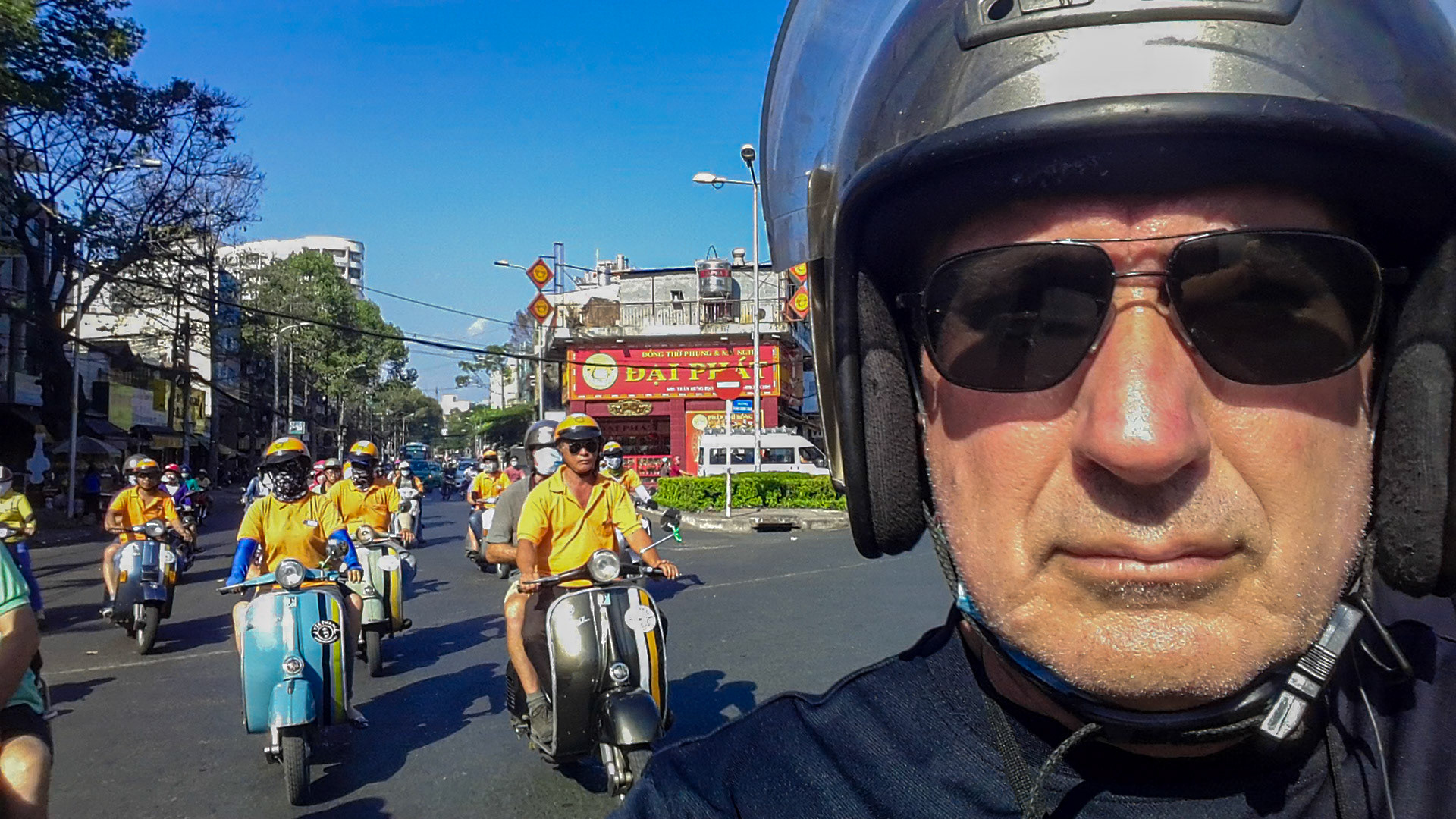 Touring Ho Chi Minh City by Vespa motor-scooter.