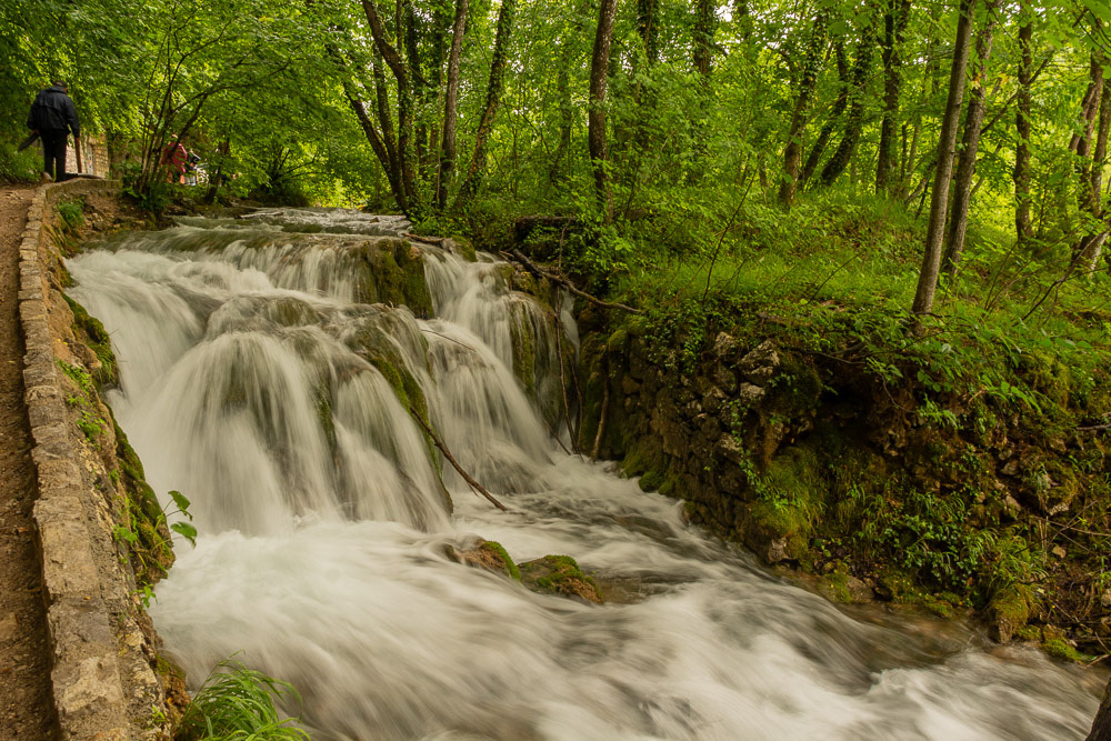 Water cascades down a rocky slope on its way to the lower lake.