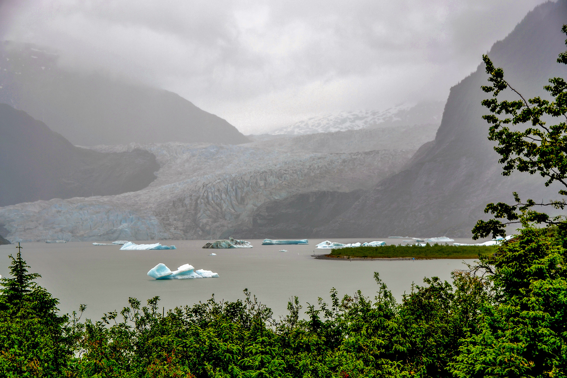 Mendenhall glacier only 12 miles north of the city is an impressive sight despite the inclement weather.