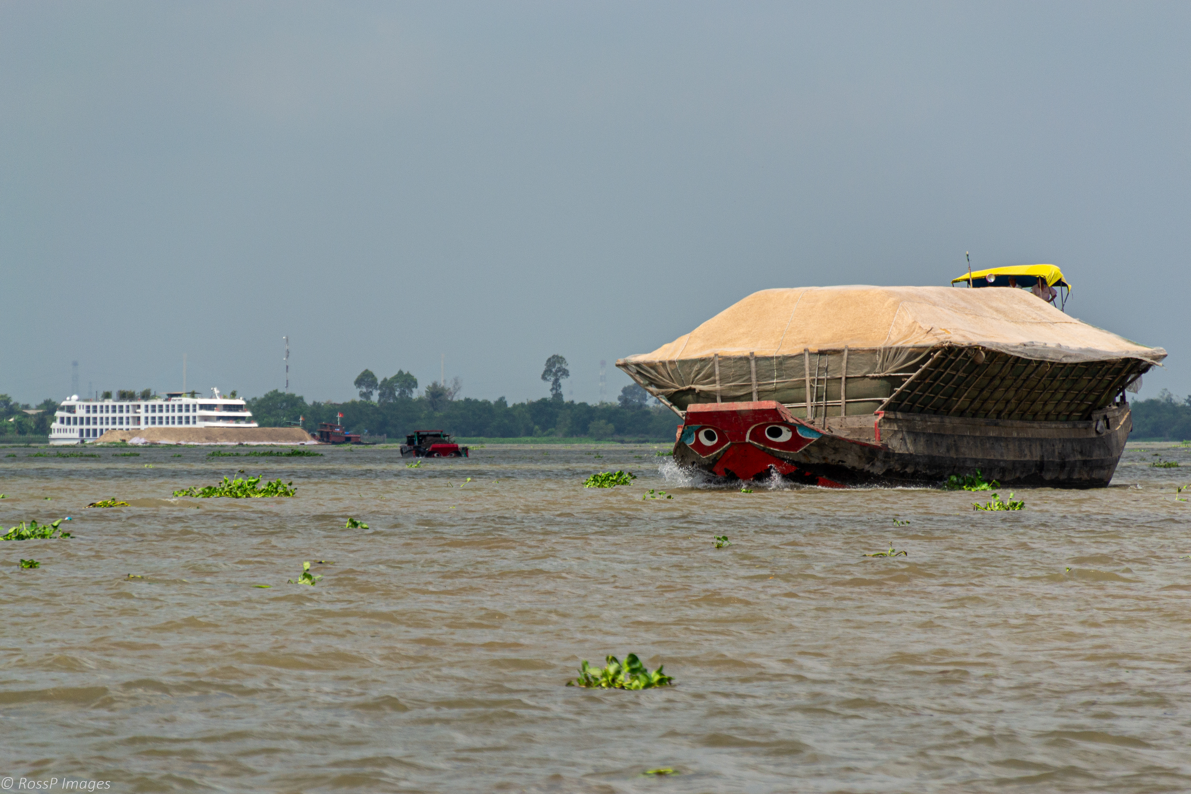 Barges framed to carry lightweight, bulky cargo.