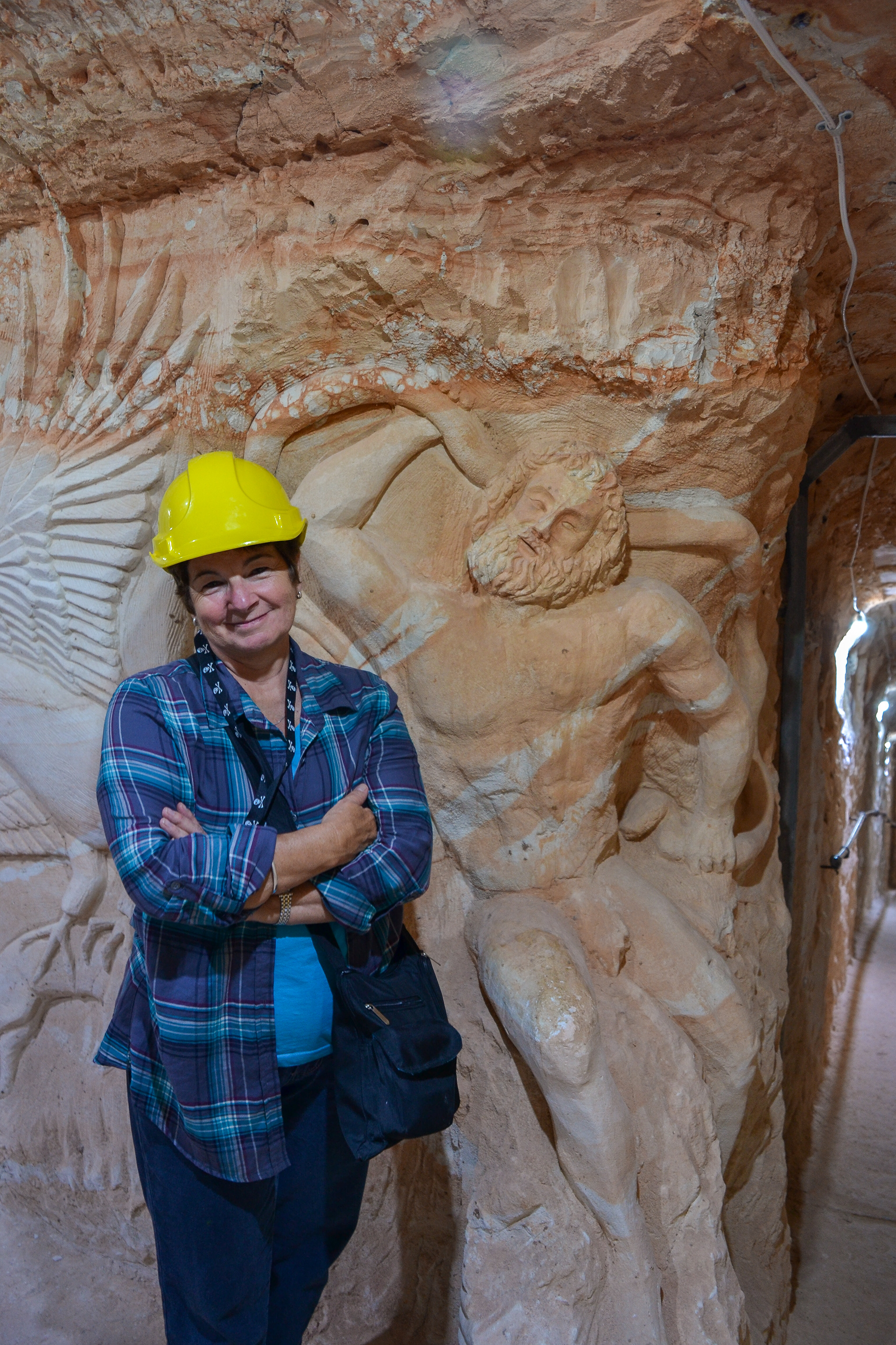 Cheryl beside one of the many hand carved reliefs.