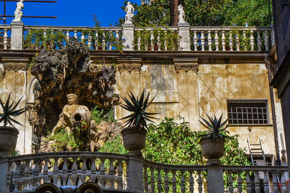 A spectacular courtyard grotto greets us when we get inside.