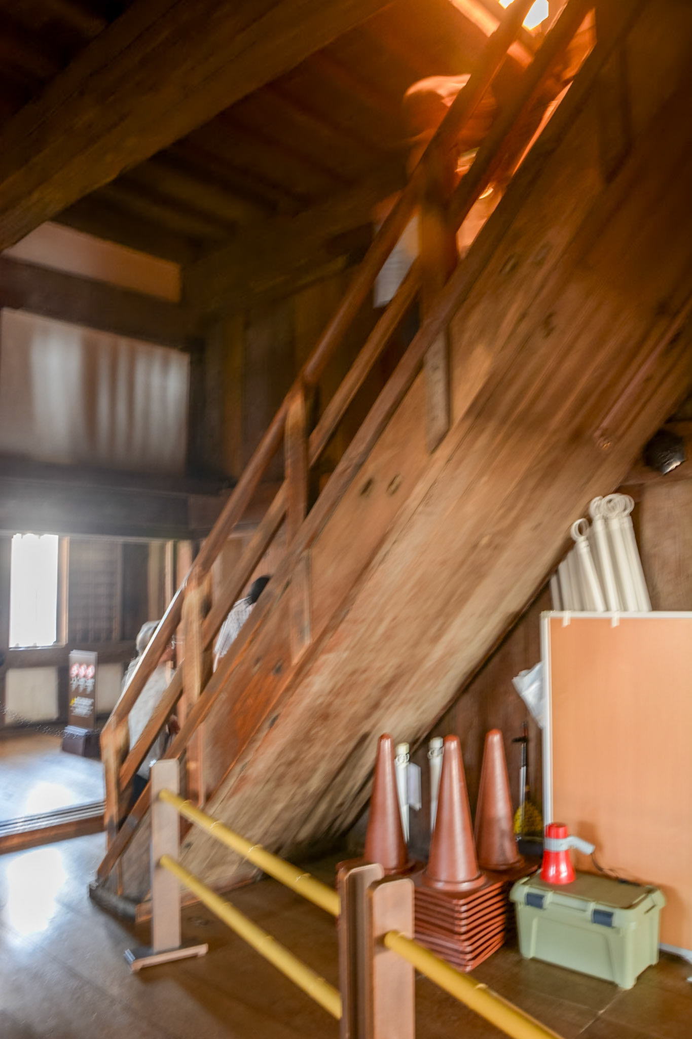 Steep, narrow stairs provide access between floor levels.