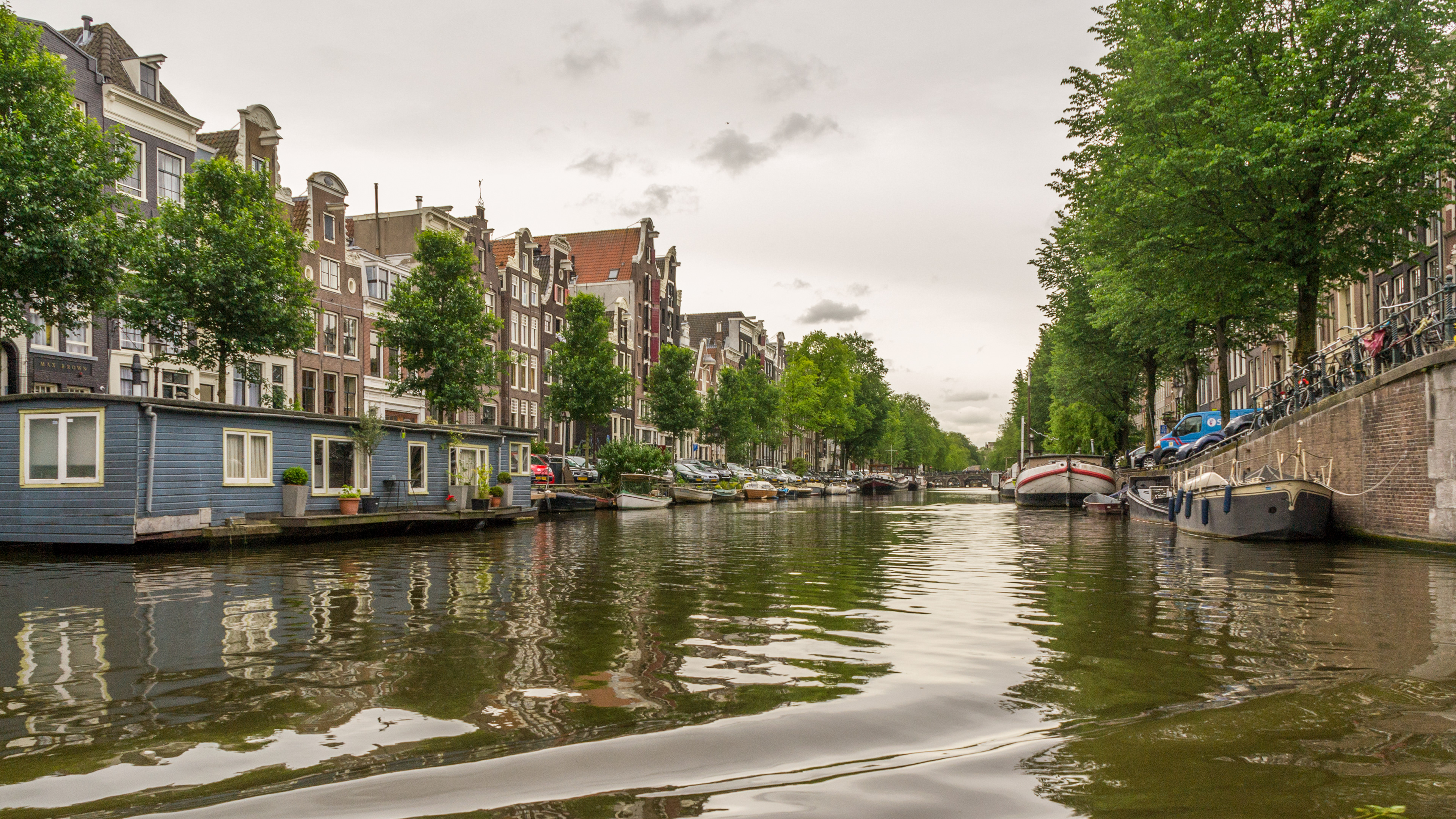 Canals are lined with house-boats in the Grachtengordel region.