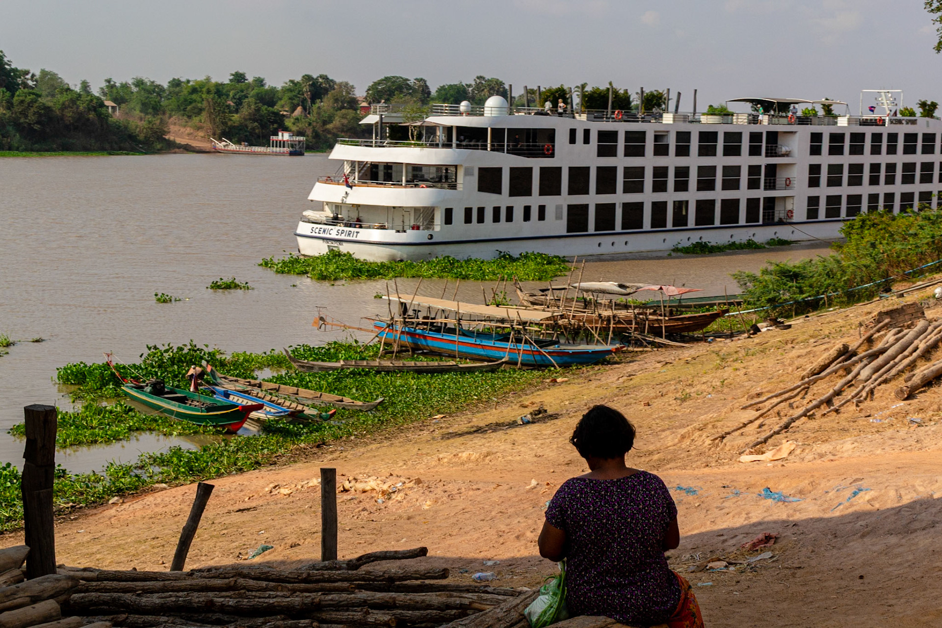 Local boats are dwarfed by the Scenic Spirit moored on the banks adjacent the village.