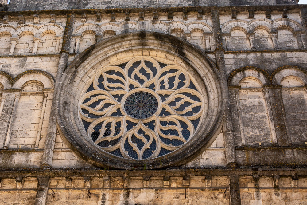 The Rose Window above the main entrance to Eglise Saint Leger.