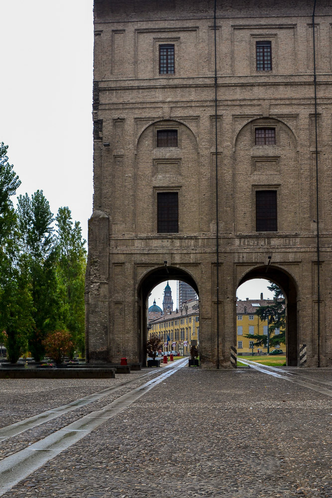 Passing through Palazzo della Pilotta into the old town on a wet day.