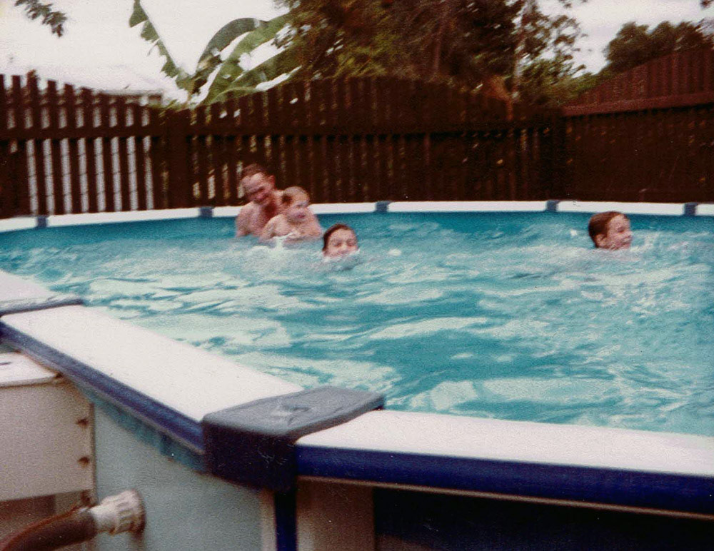 Ed having fun with the grandkids in Bill's pool, Penlington St.