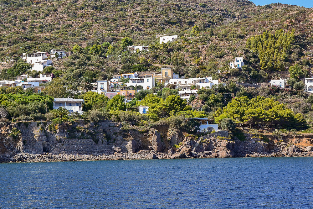 Whitewashed villas perched on the rugged slopes of Panarea Island.