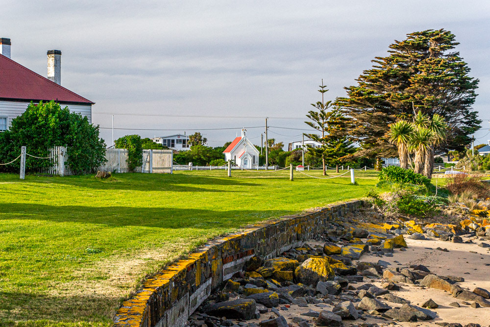 Low Head Pilot Station grounds. In the background is a little church is the oldest church building in the George Town municipality.
