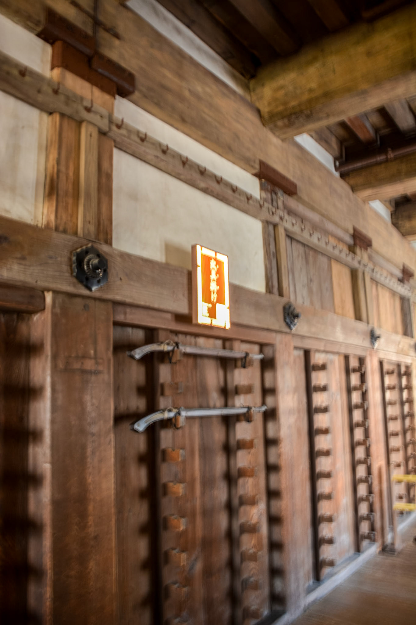 Weapon racks on the walls of the keep. Tanegashima, a type of matchlock-configured arquebus firearm introduced to Japan in 1543 are displayed here.