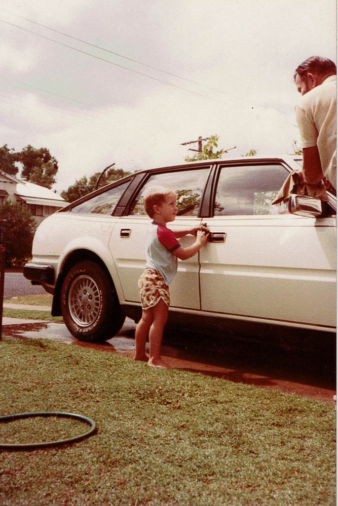 Alex helping Grandad wash Don's car.