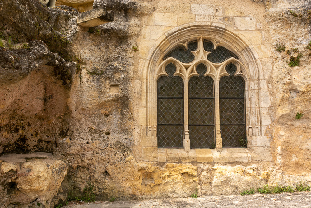 Exquisite masonry with leadlite windows seal natural openings and light the interior.
