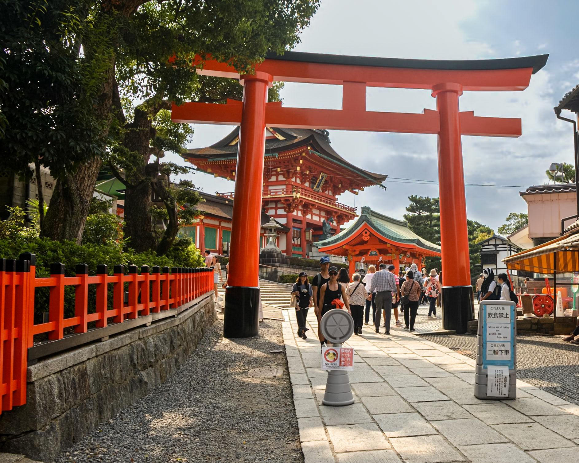 Fushimi-ku Kyoto, our group joins the ever constant stream of tourists in the streets leading towards the main gate of the Fushimi Inari-Taisha Shrine.