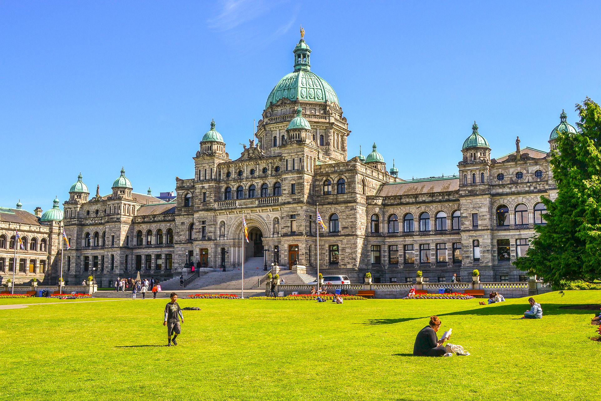 Locals enjoying the sunshine in the grounds of Parliament House of British Colombia