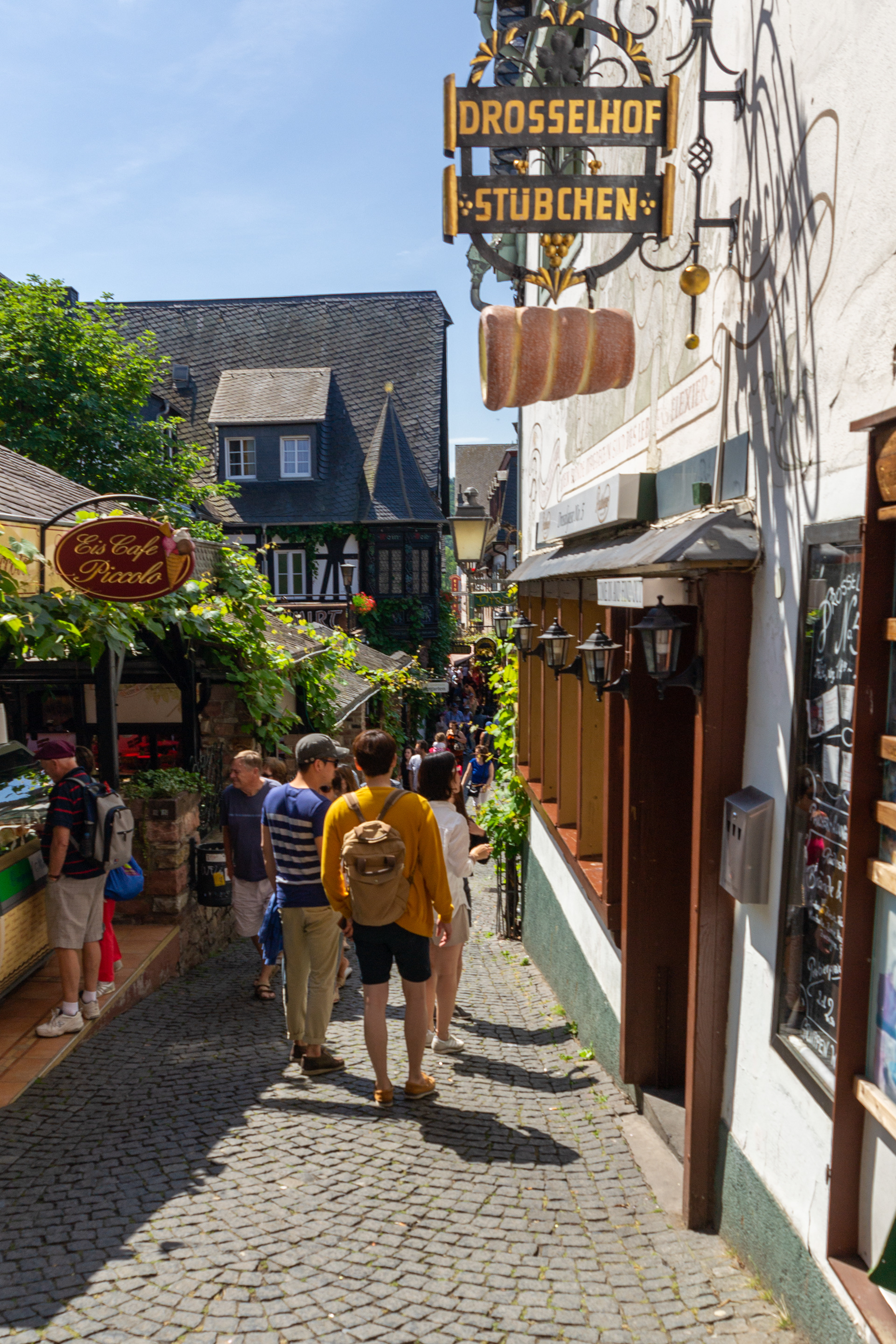 Tourists exploring the Drosselgasse.
