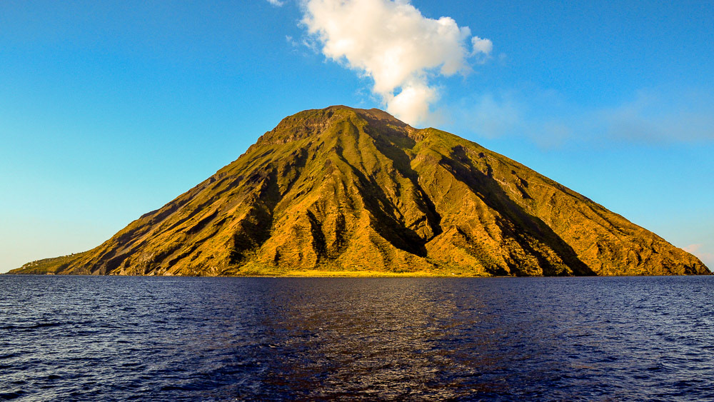 The stark, rugged, beauty of Stromboli rising out of the deep blue water of the Tyrrhenian Sea is truly a awesome sight.