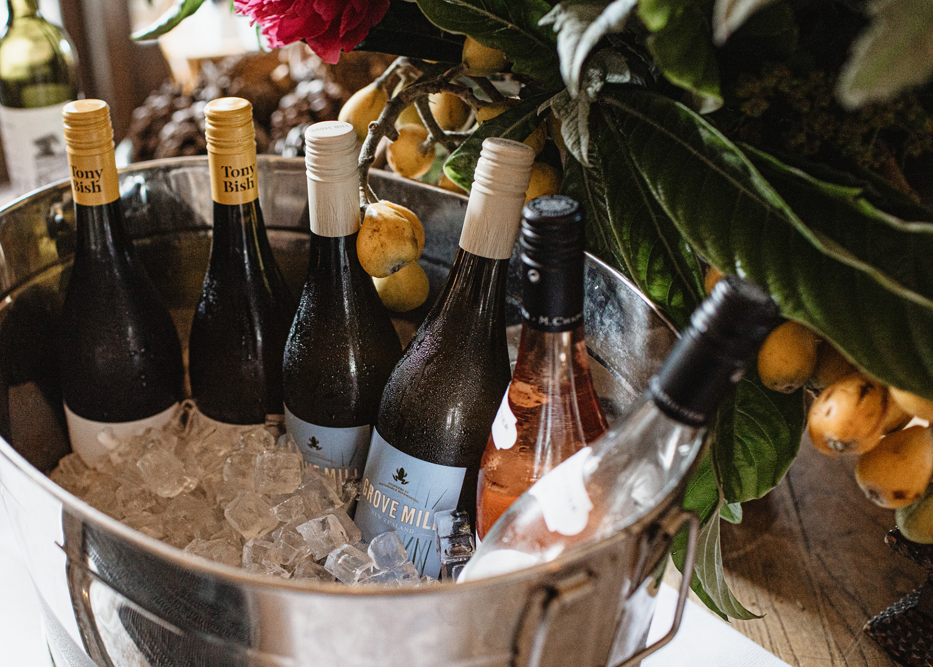 An ice bucket full of wine offerings.
