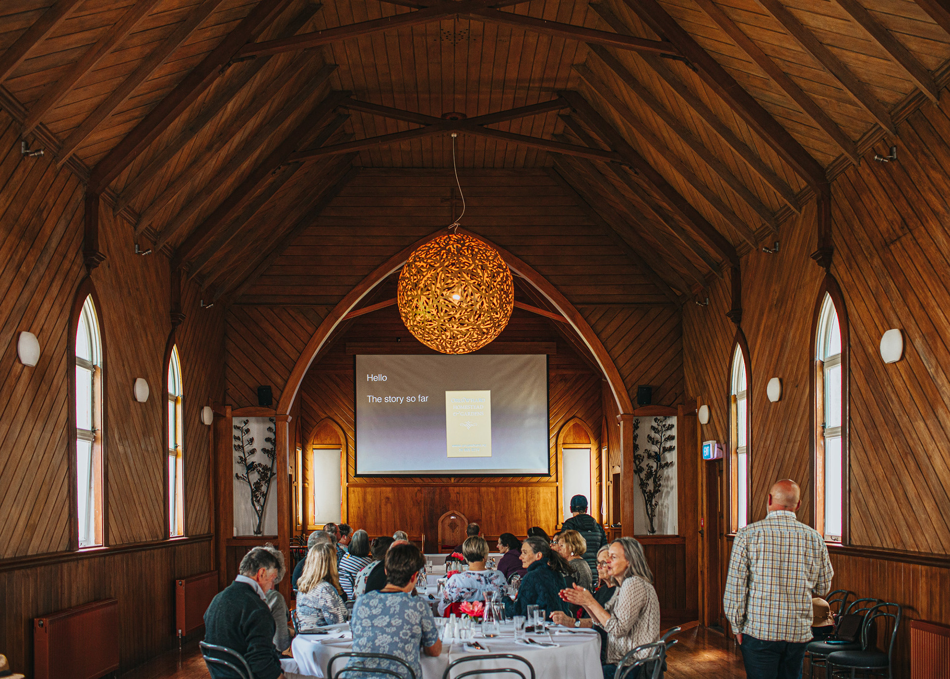 Oruawharo Homestead function space - guests enjoy a presentation about the homestead's colourful history