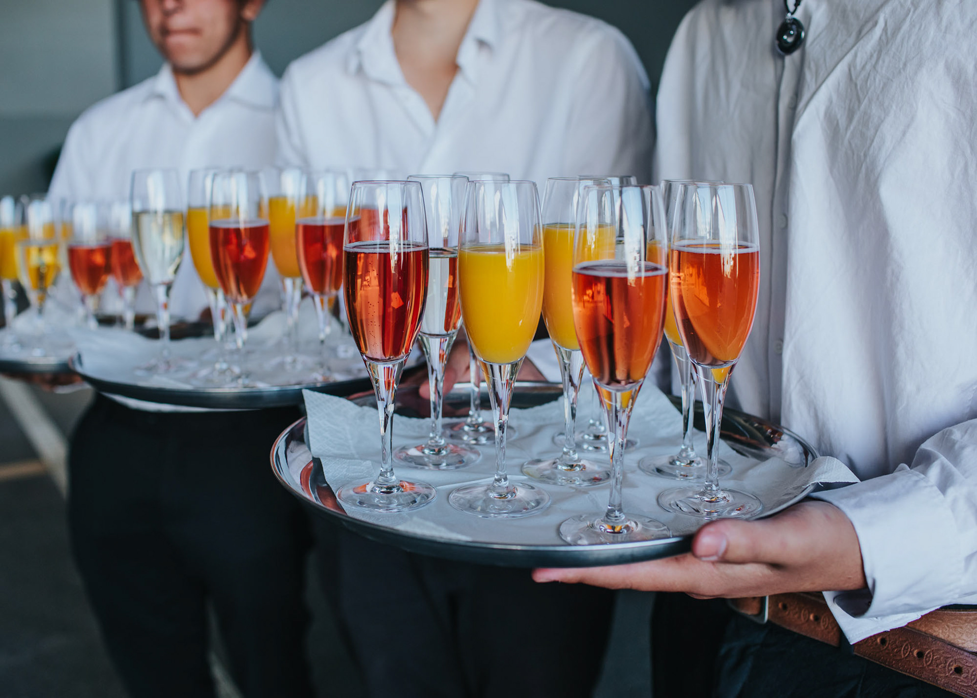 Glasses of wine and refreshments being served by wait staff