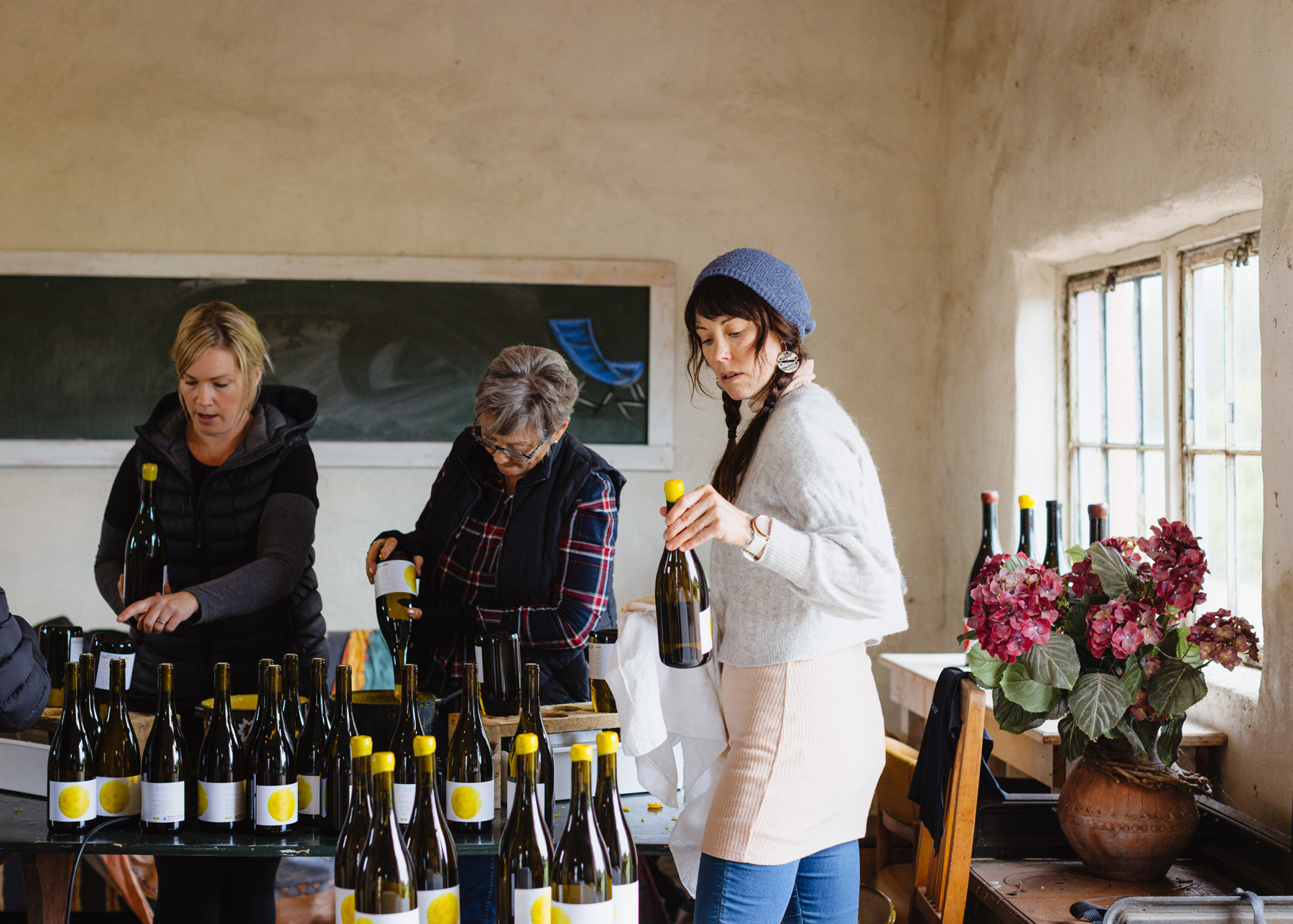 Helio Wines 2022 Chardonnay - Waxing the bottles is a family and friends affair