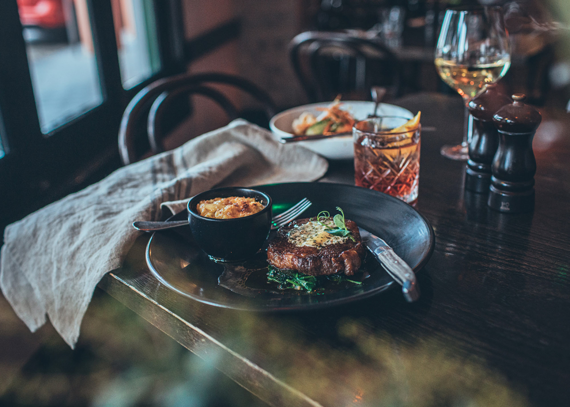 A steak dish from the Emporium restaurant menu