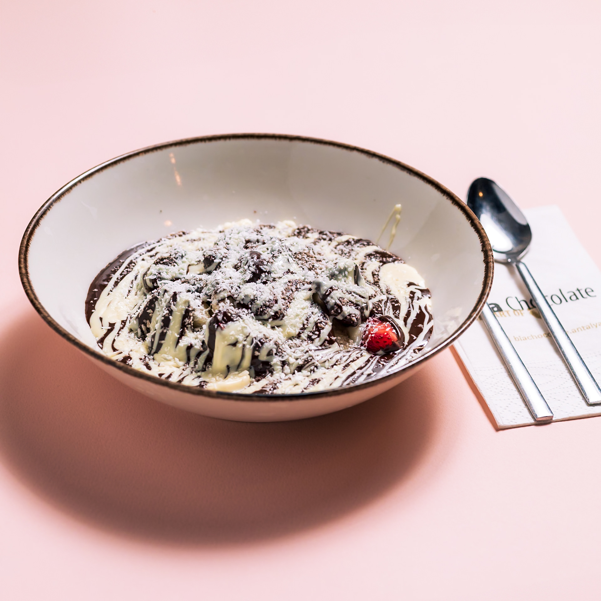 BOMBIA A chocolate masterpiece smothered in both white and dark chocolates.