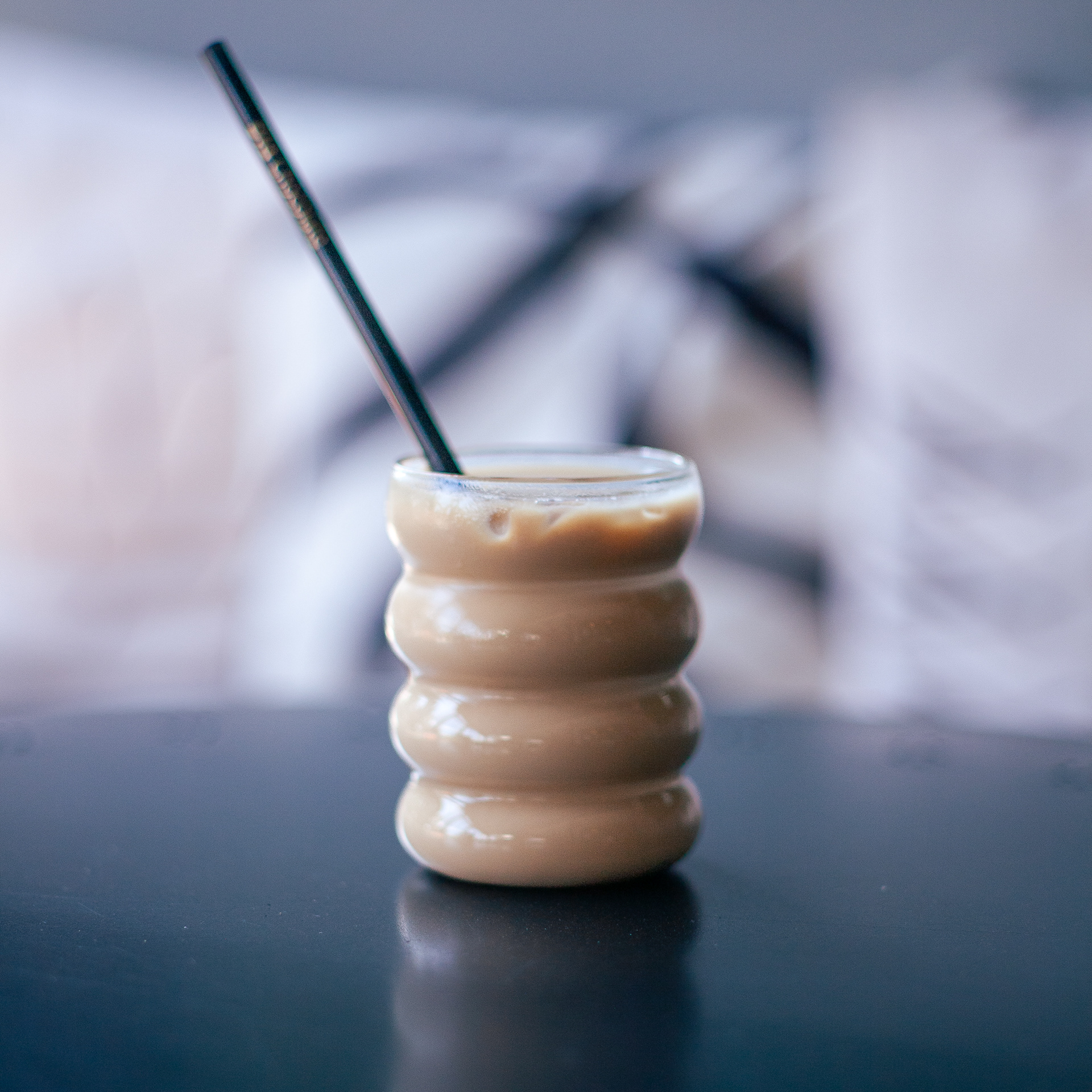 ICED LATTE Chilled and iced silky smooth espresso with milk to help you chase down that delicious Bombia chocolate