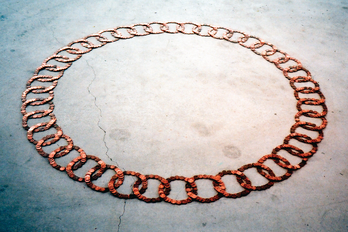 Pennies stacked in interlocking rings . Core Sample . Portland, Oregon . 2003