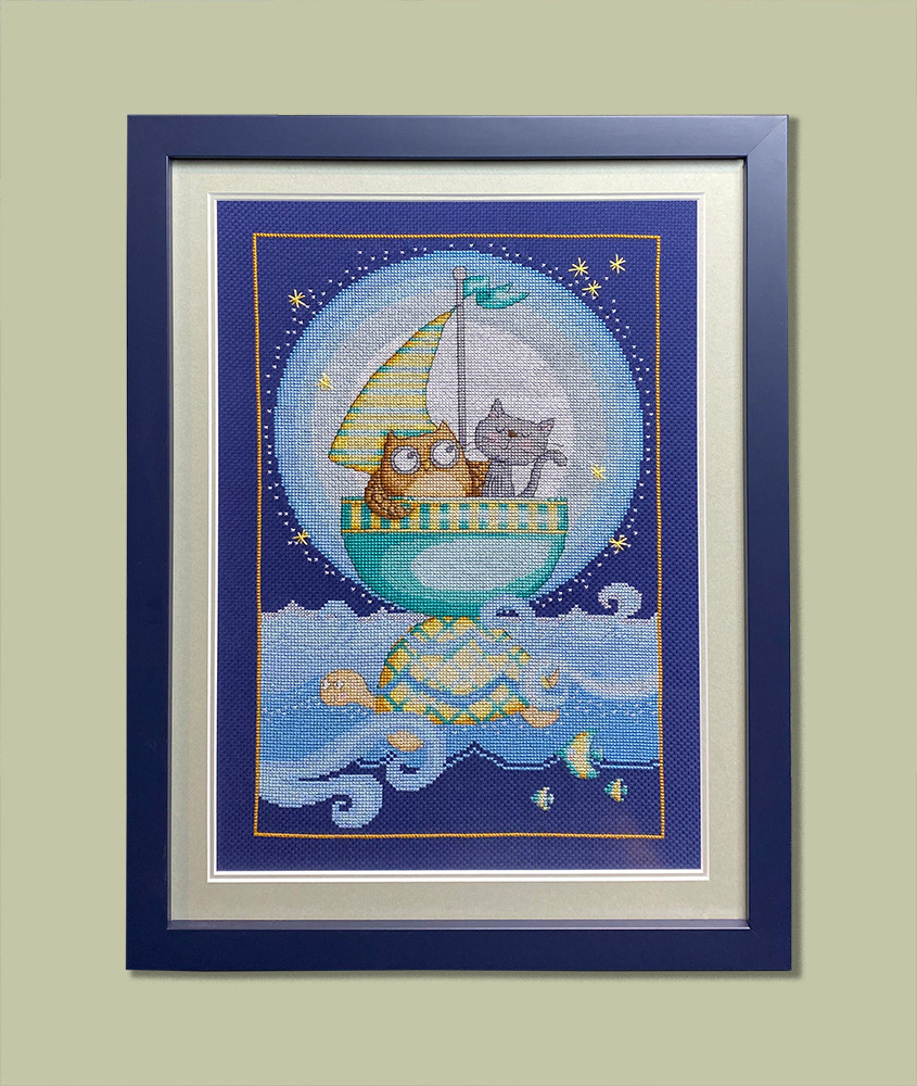 X-Stitch framed to Level 2. Artwork is laced, double conservation mount, UV99 glass