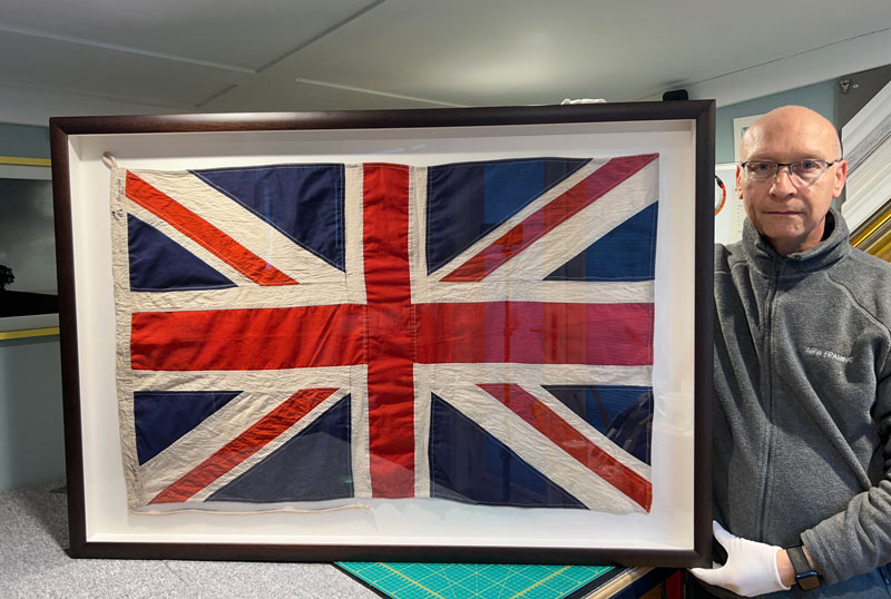 WWII Union Jack. Hand stitched to Conservation board, UV99 Glass