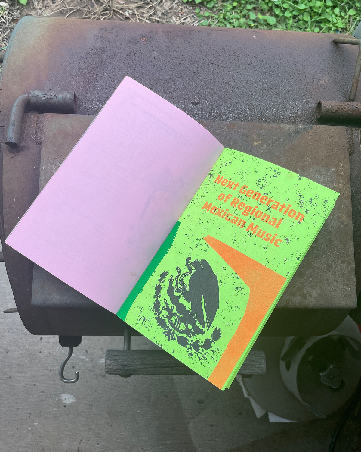 Front cover of my zine. Every zine was riso printed on color paper. On the left is the back cover of one of my classmates zine. Credit to them.