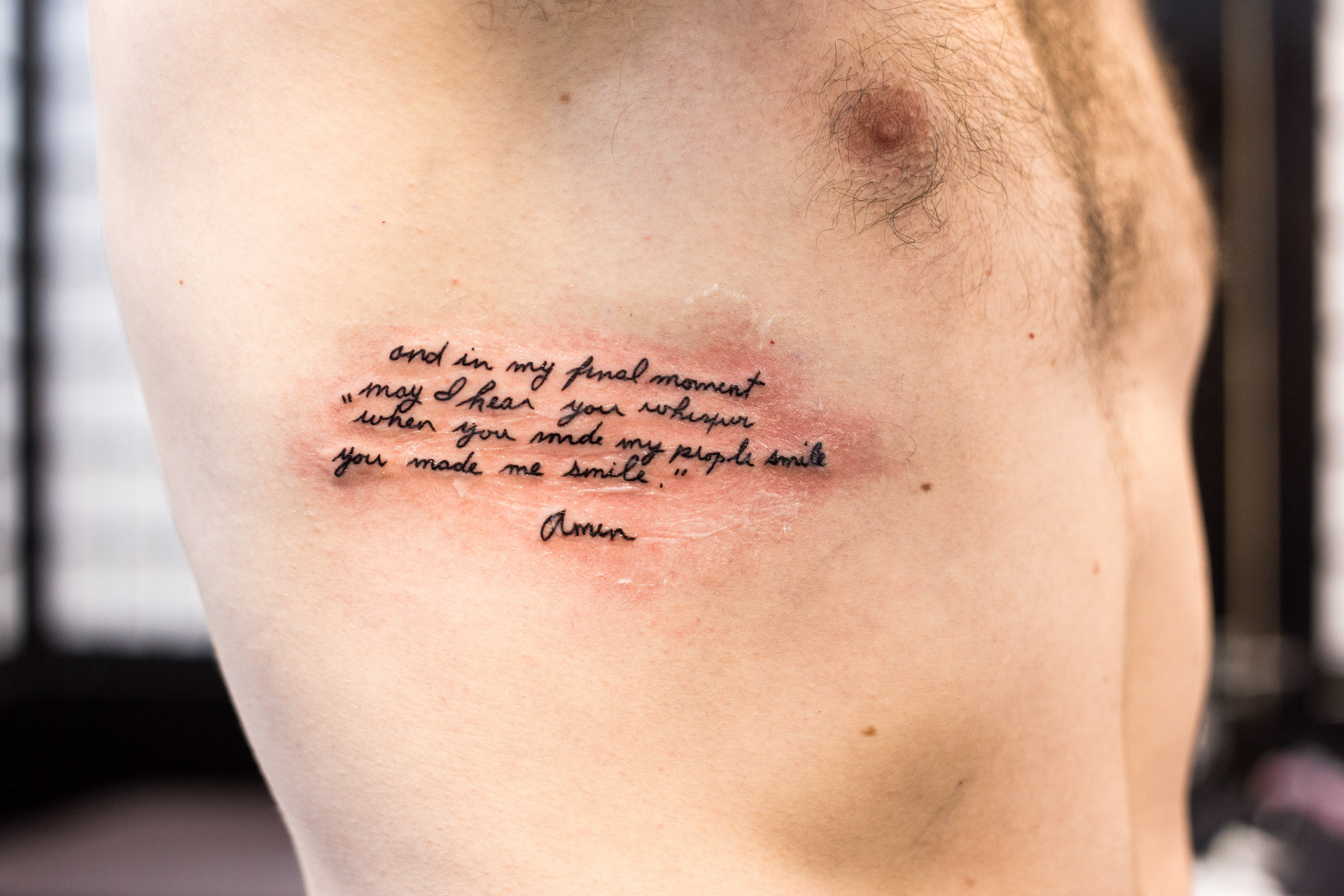 A fresh tattoo of a verse from "The Clown's Prayer" written in Nana's handwriting. " and in my final moment/ may I hear you whisper/ 'when you made my people smile/ you made me smile.' "
