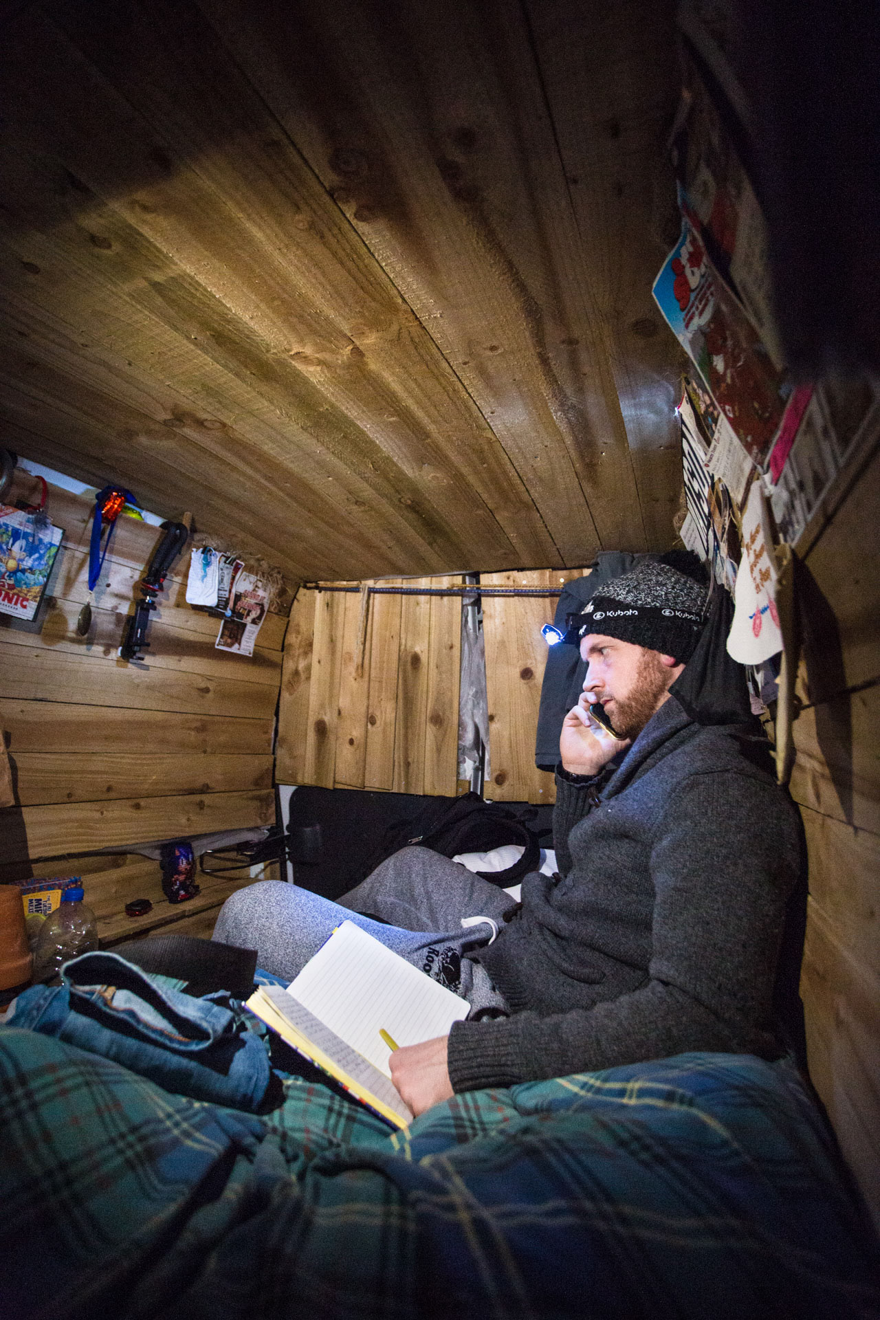 Matt in his van on a late evening, working on his comedy and speaking to a comedian friend.