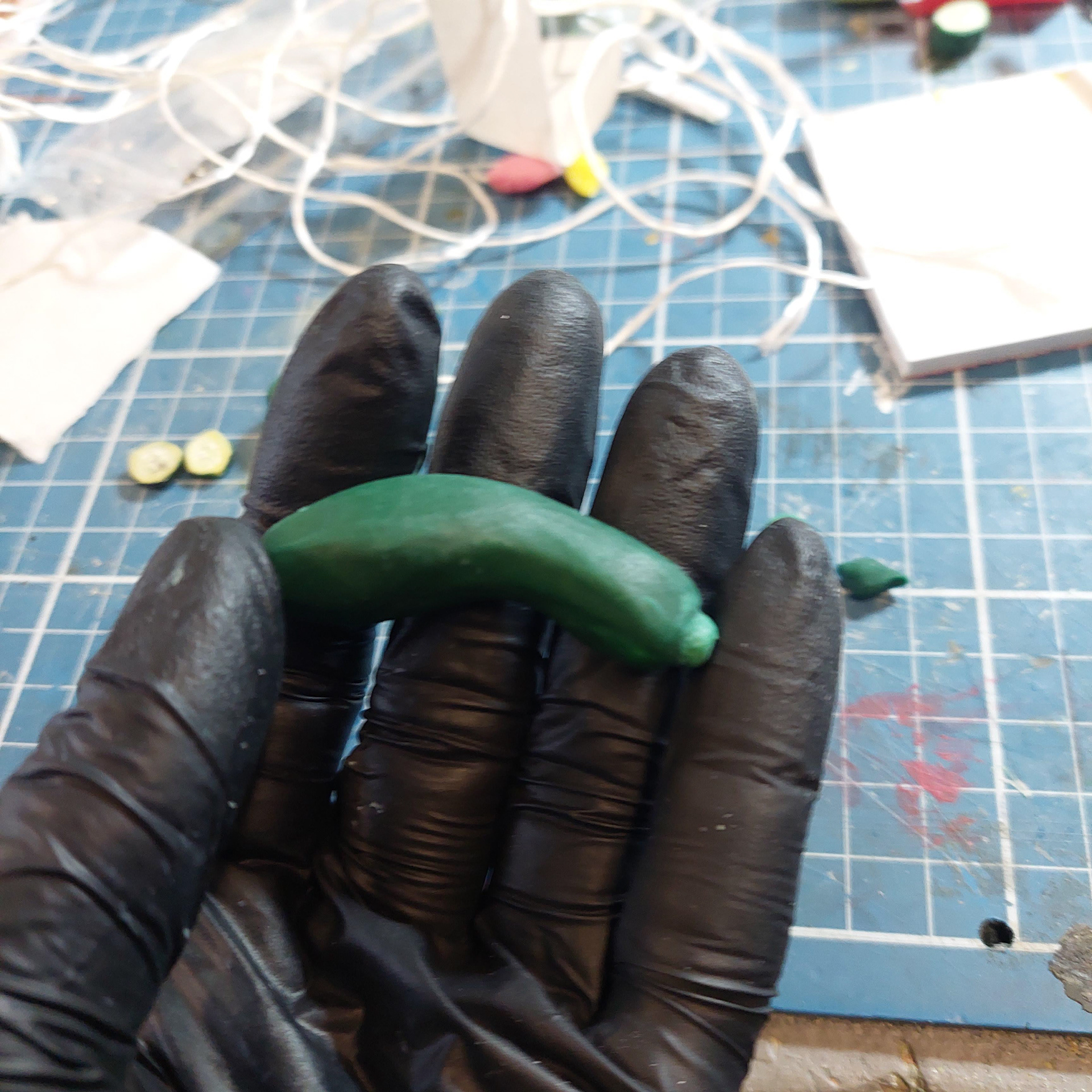 Crafting a zucchini with clay