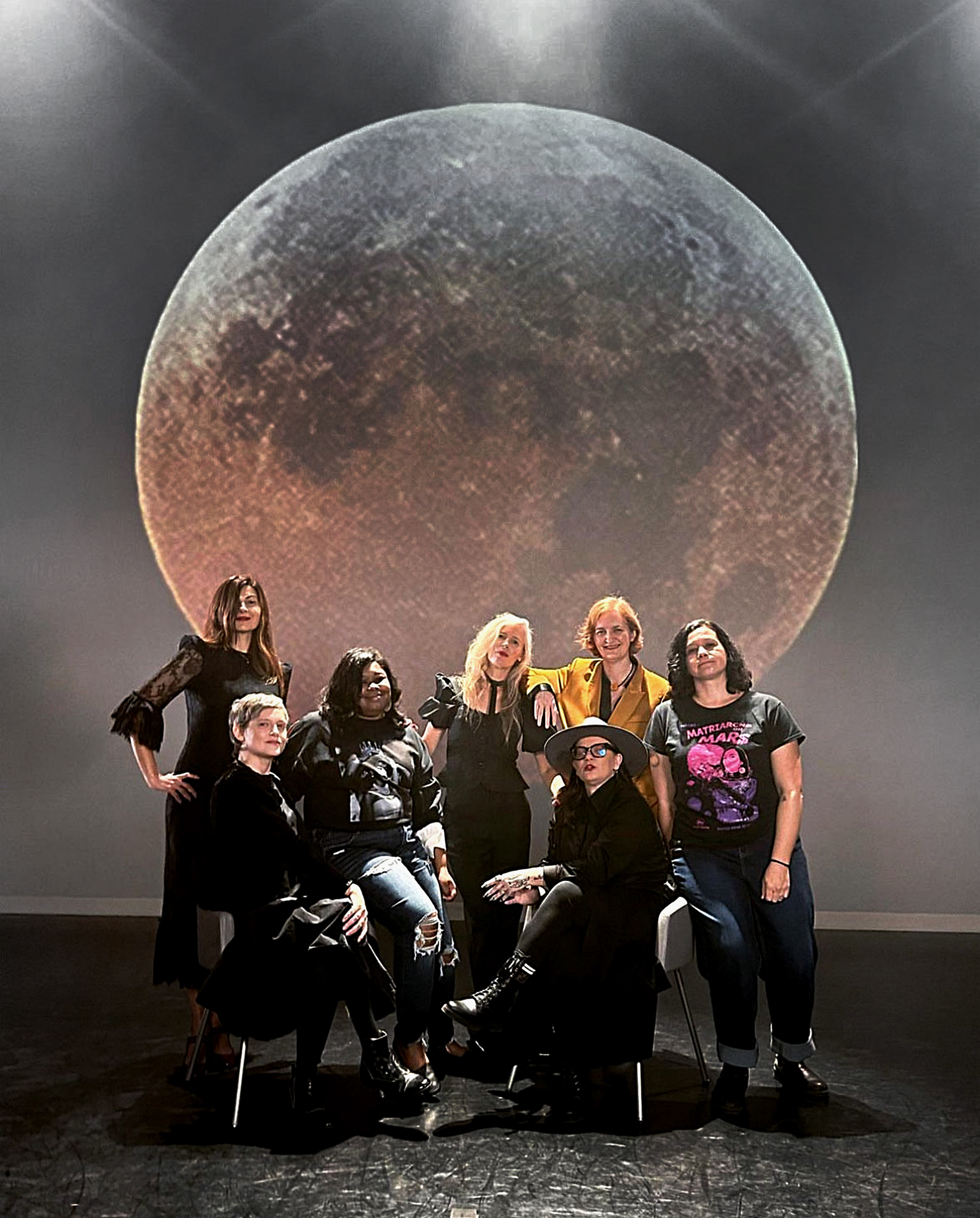 Authors in front of Lunar Eclipse on stage, 2024, Photo by Heather Saitz