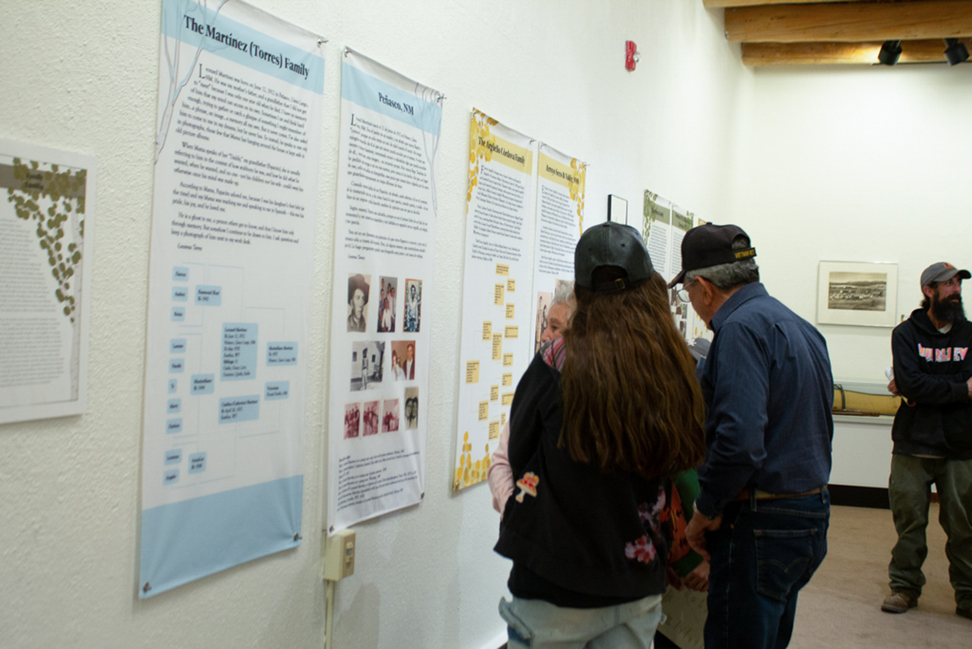 The Martinez family viewing panels of their family and backgrounds.