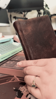 Hand-bound leather journal with stitch and paper