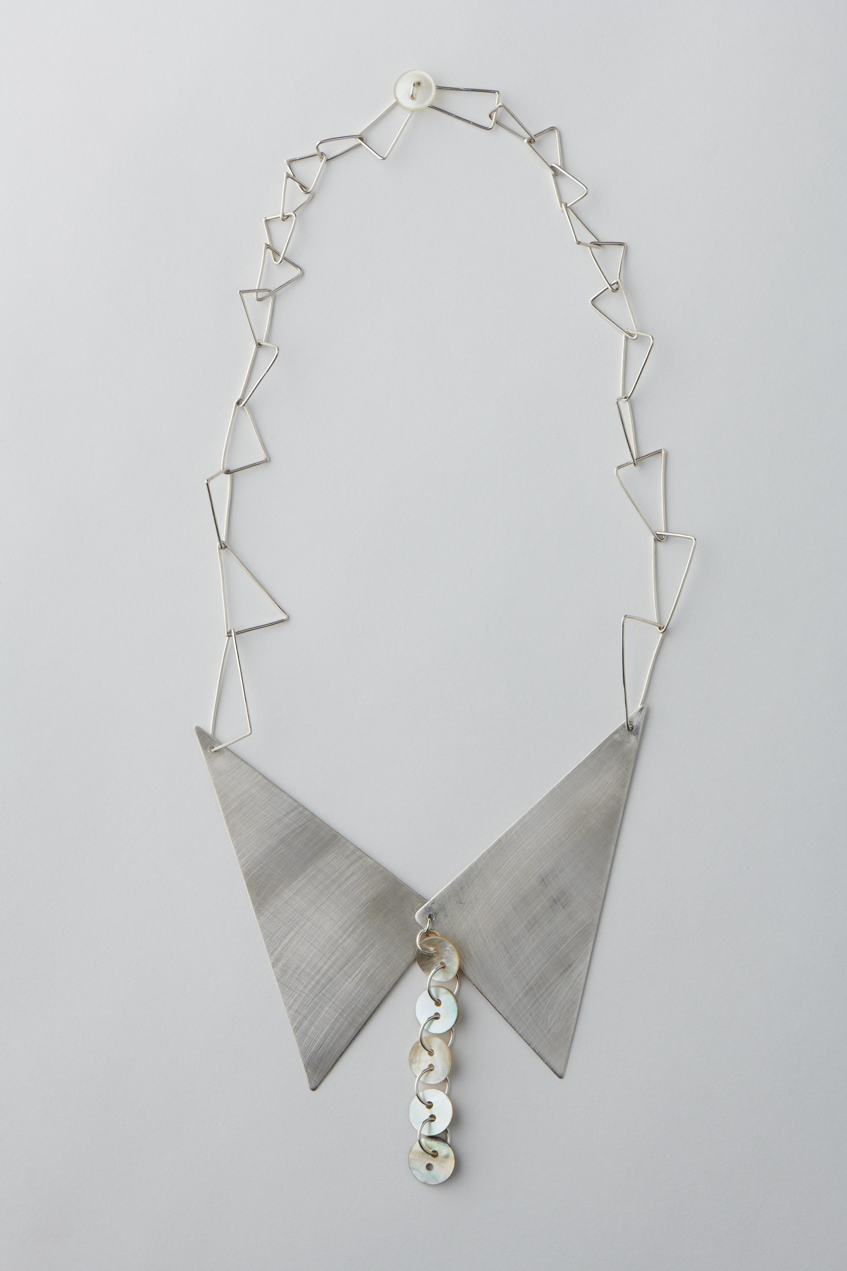 Preservation 2. Silver with shell buttons. Photo by Fred Kroh, August 2021.