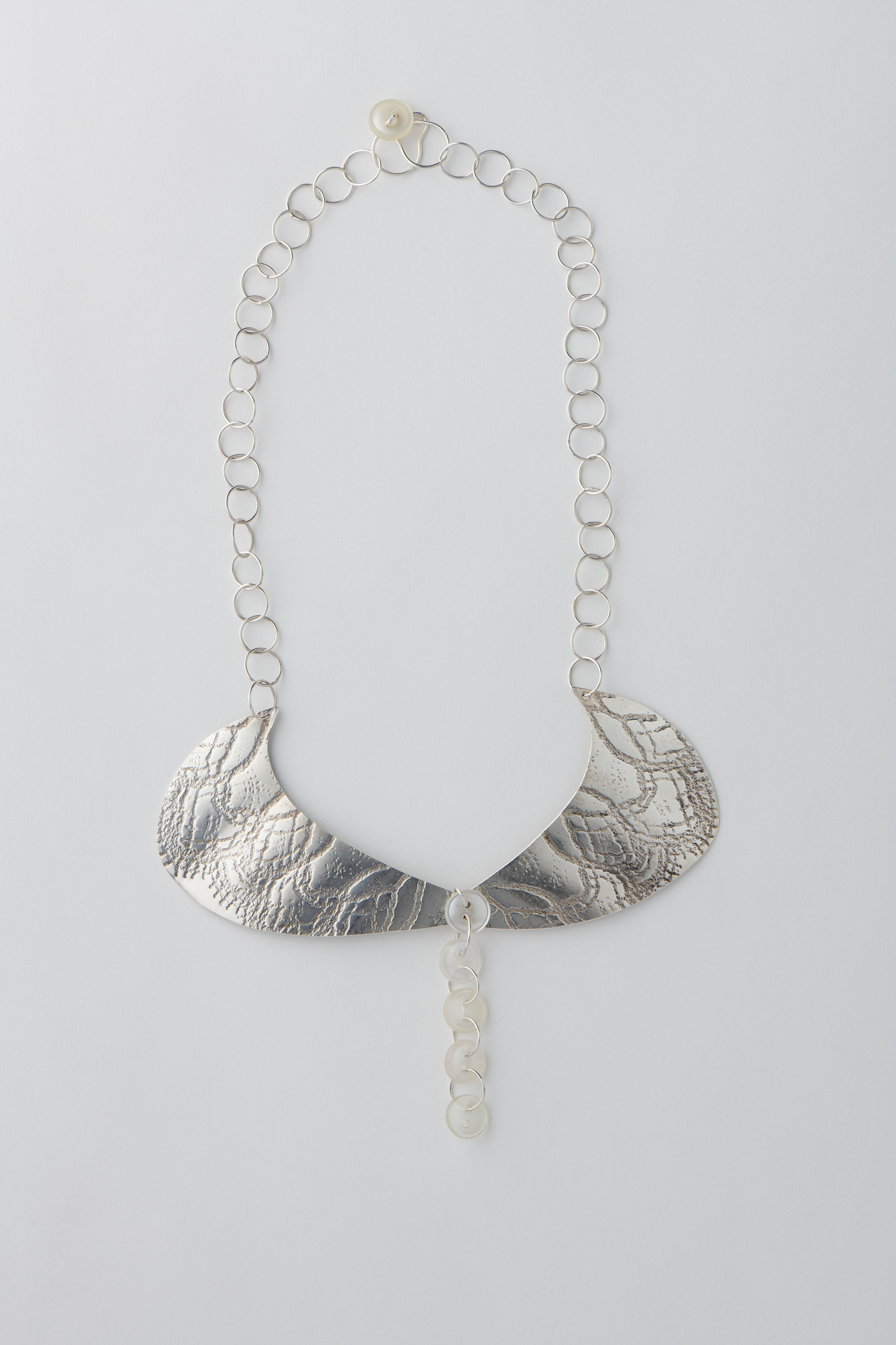 Preservation 1. Silver with plastic buttons. Photo by Fred Kroh, August 2021.