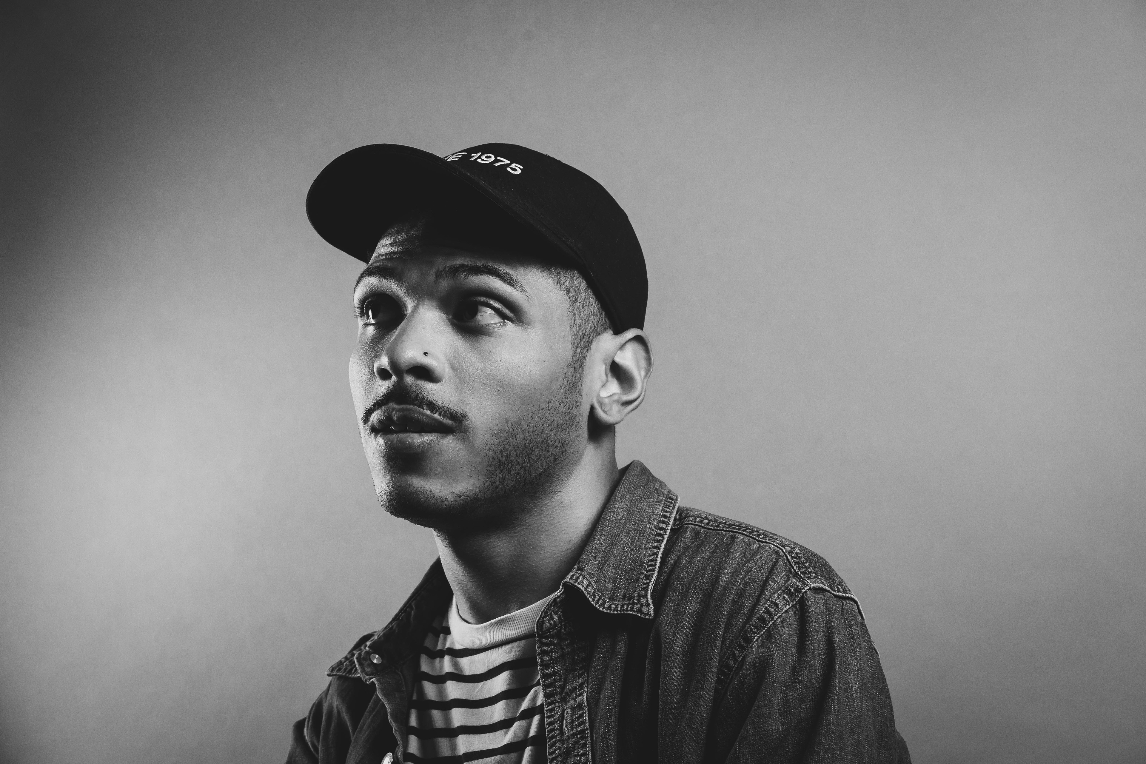 Greyscale portrait of Justin Ebanks