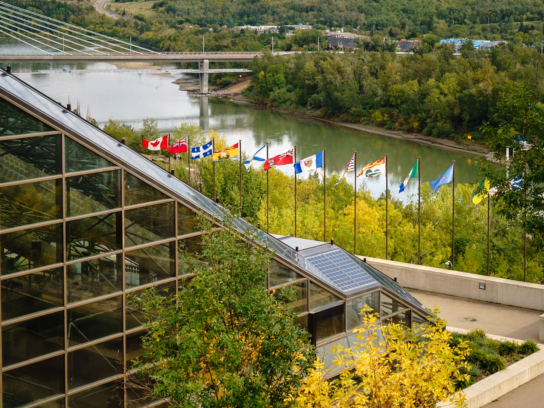The Canadian flag and a flag for each of the Provinces of Canada - in front of the Edmonton Convention Centre.