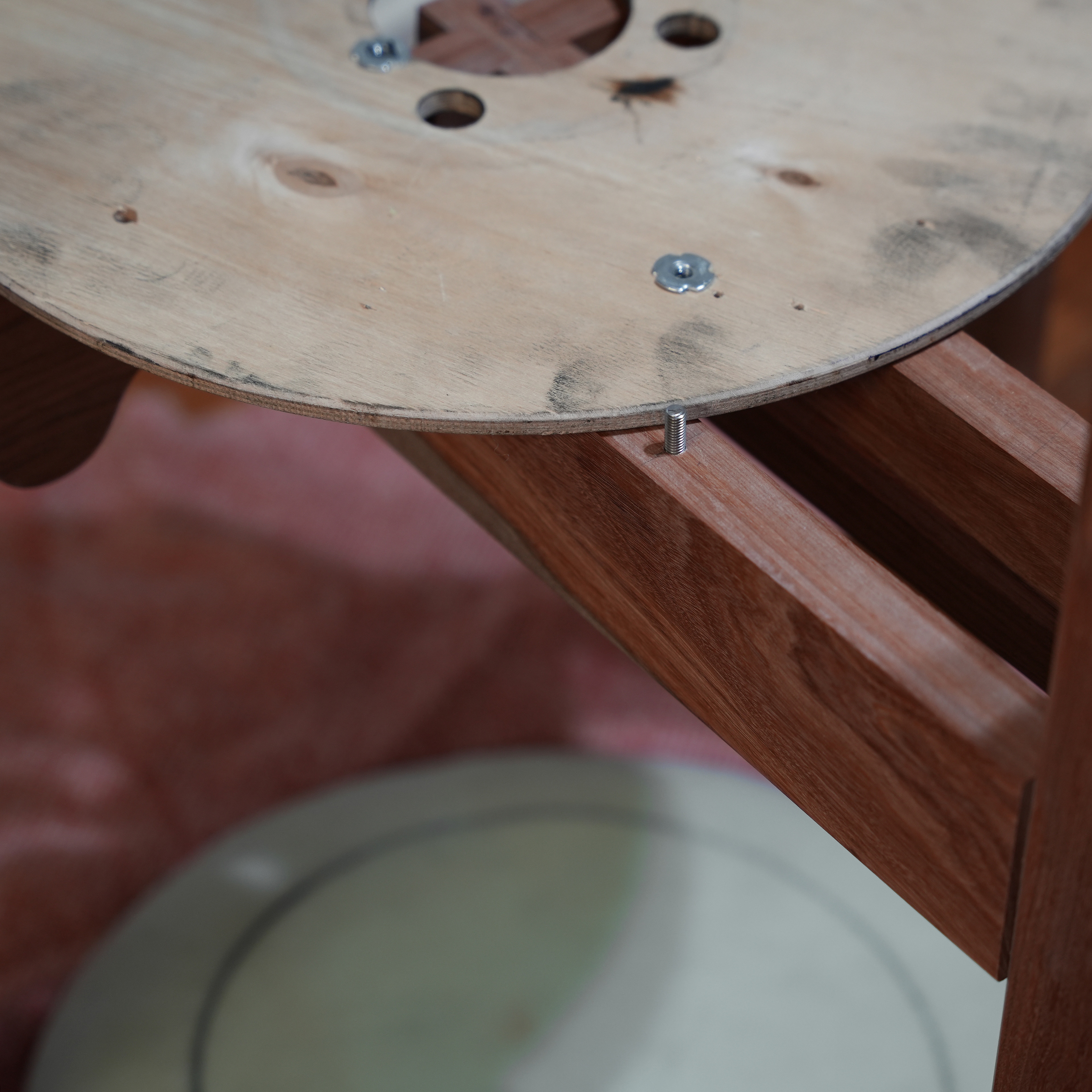 Bolting cable drum seat to frame.