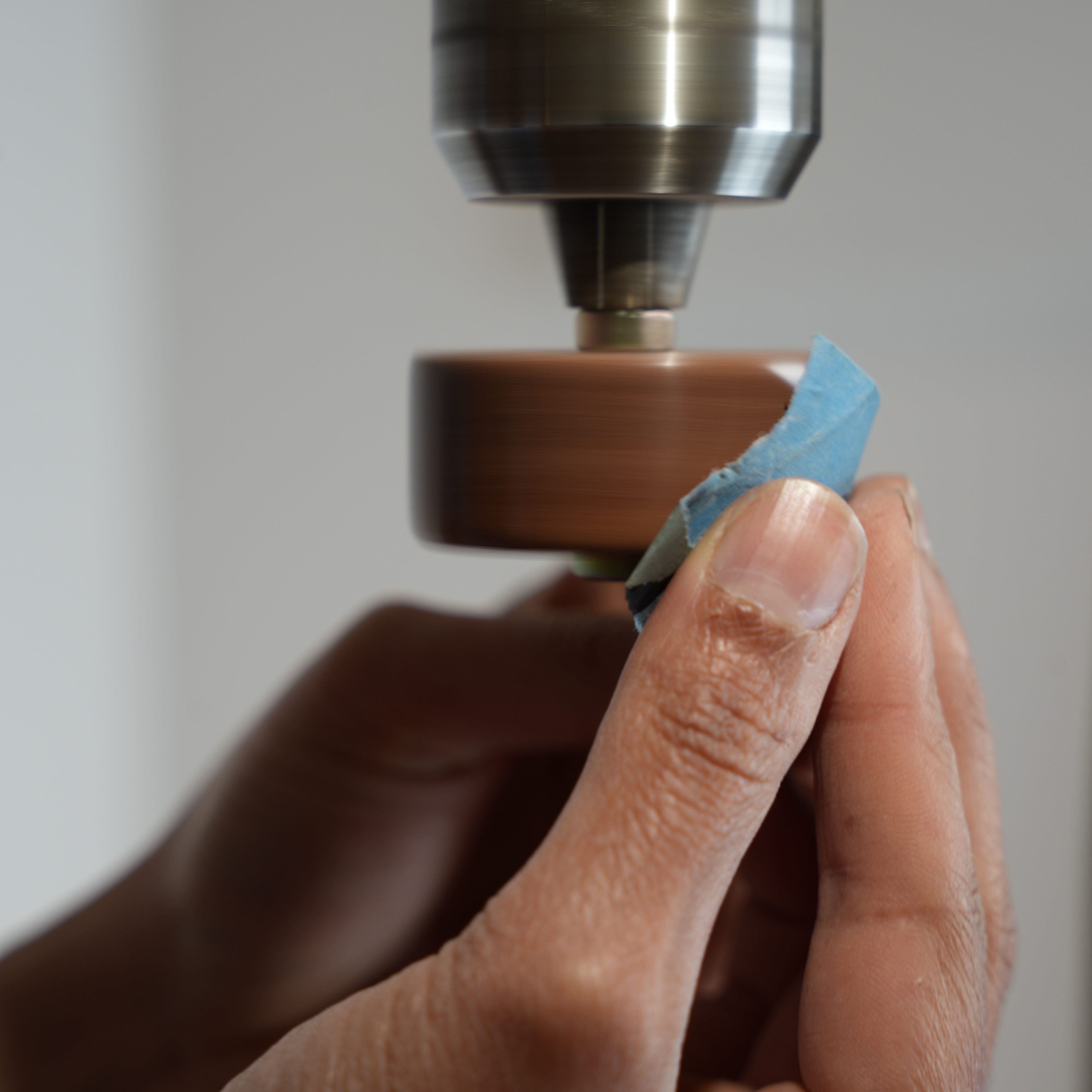 Polishing spotted gum on drill press.