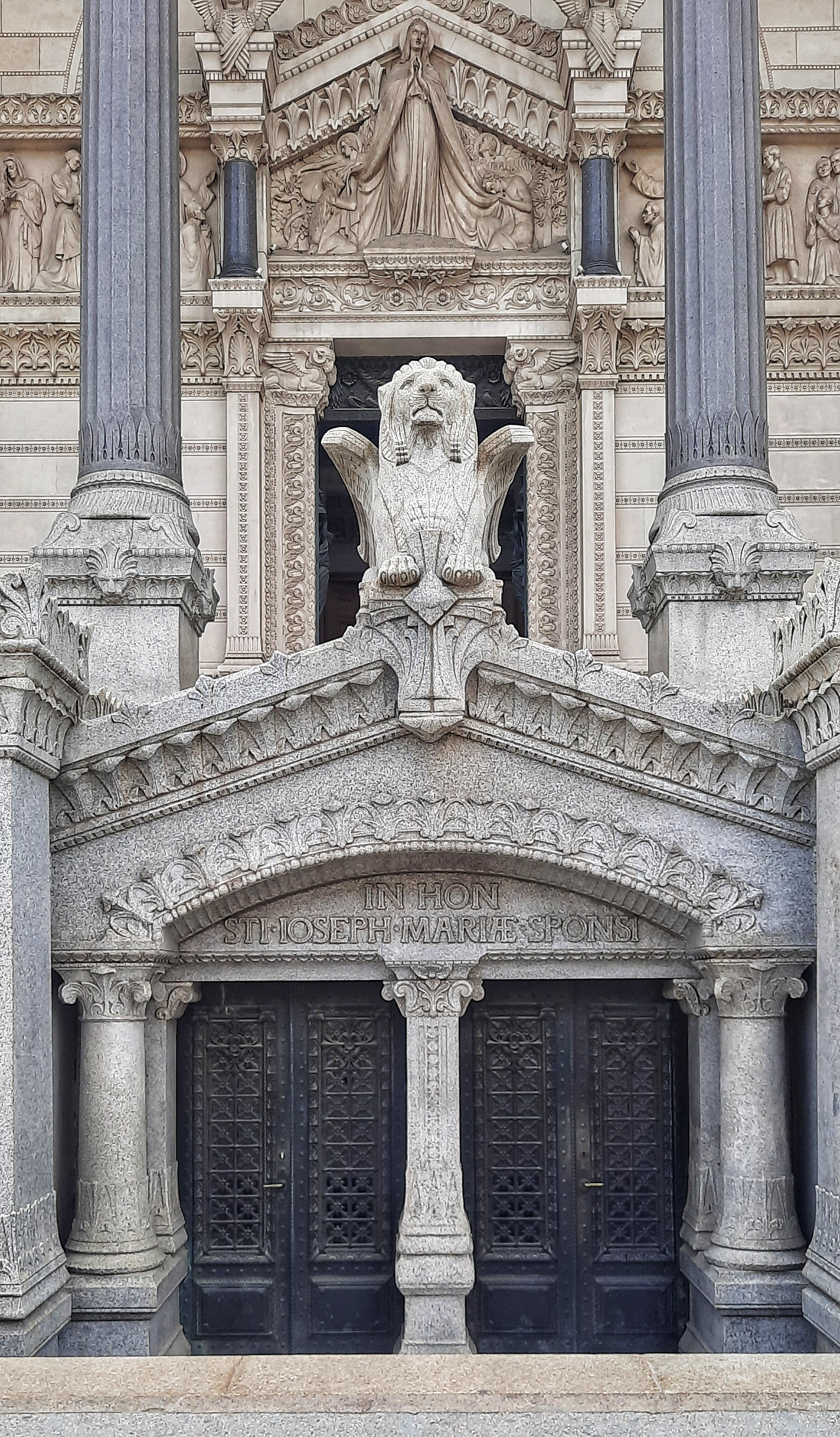 Detailed work at the Entrance of the Basilica of Notre Dame de Fourviere of Lyon, France